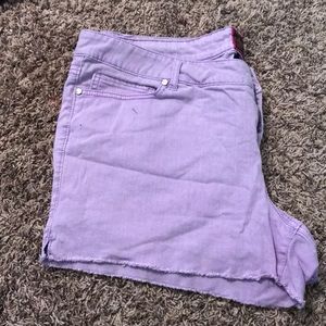 Light purple denim shorts.